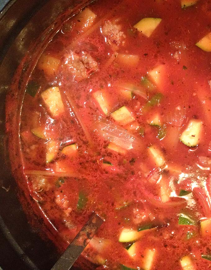 Hearty Italian Sausage Soup bursts with flavor and eats like a meal. Parmesan cheese is the secret ingredient.