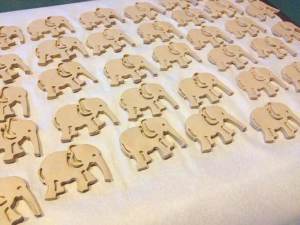 DIY Clay Elephant Christmas Ornaments. Quick to make, fun to gift. Animal Cracker cookie cutters make such cute little ornaments.