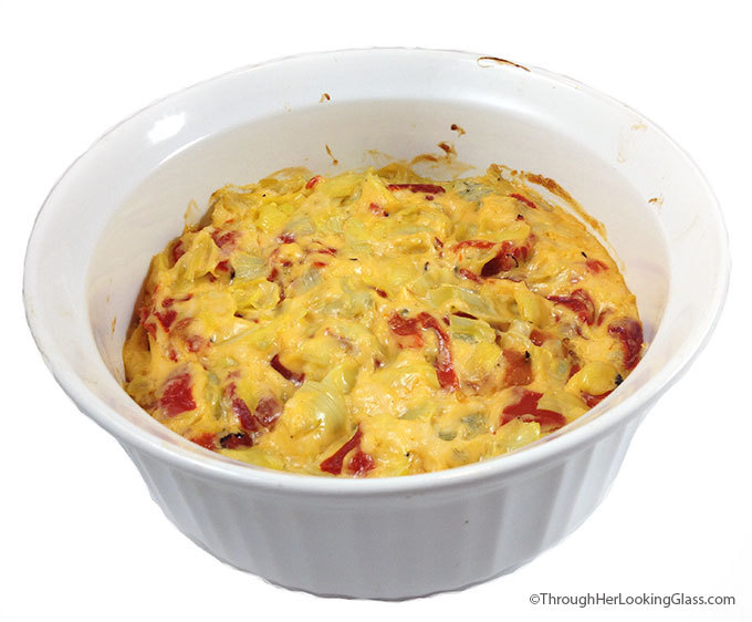 Baked Cheesy Artichoke Dip. Mmmmm. Creamy, melty parmesan, garlic, artichokes and sweet roasted red peppers. Serve with veggies, pita chips, blue corn chips