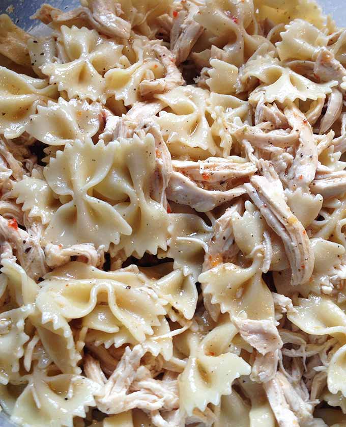 Chicken Artichoke Pasta Salad with Sun Dried Tomatoes: a bold tasting main dish pasta salad. Perfect for spring and summer, picnics and outdoor concerts.