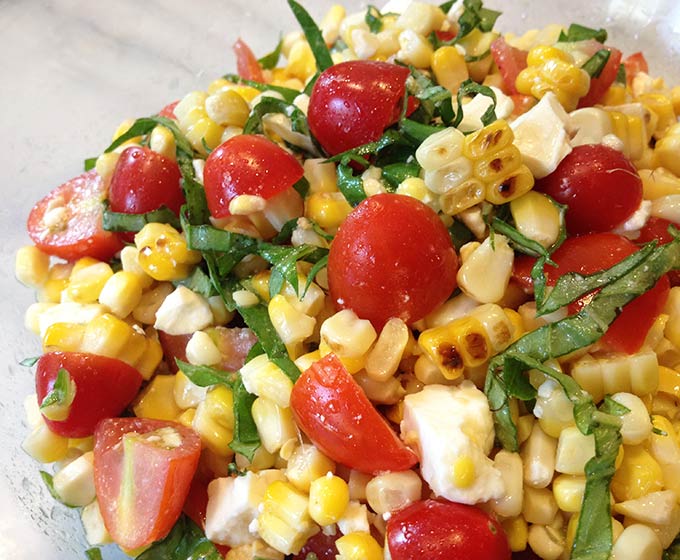 This Grilled Corn Basil and Tomato Salad brings fresh and summer straight to your next picnic, barbecue or luncheon.