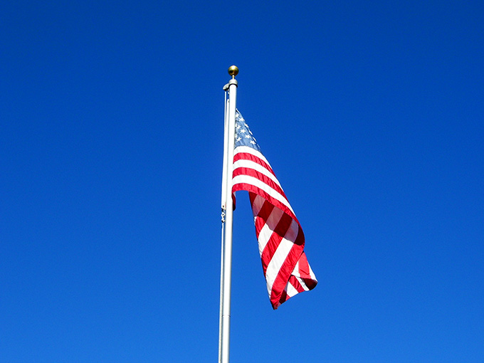 Stars & Stripes. "And I'm proud to be an American, where at least I know I'm free. And I won't forget the men who died, who gave that right to me."