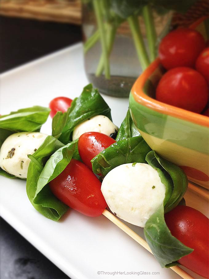Caprese Mini Kabobs: a quick healthy treat. The easiest most colorful garden fresh appetizer you'll ever make. The perfect accompaniment to grilled burgers.