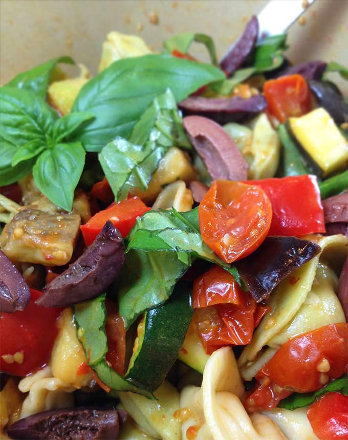 Roasted Veggie Mediterranean Tortellini. Fresh pasta salad. Eggplant, red pepper, tortellini, kalamata olives, cherry tomatoes, basil, zucchini.