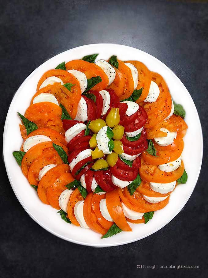 Caprese Salad Tomatoes: spectacular & easy to make. This platter features Orange Wellington, Opalka, and Yellow Pear tomatoes. Sweet and delicious.