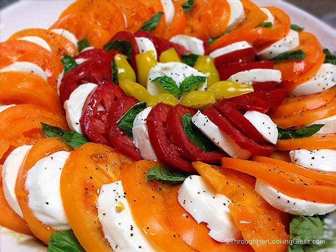 Caprese Salad Tomatoes: spectacular & easy to make. This platter features Orange Wellington, Opalka, and Yellow Pear tomatoes. Sweet and delicious.