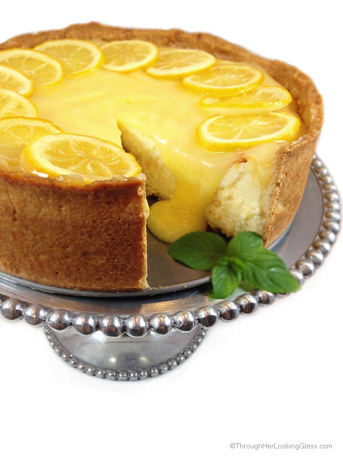 Lemon Bar Cheesecake. Deliciously sweet and crunchy crust, creamy cheesecake and tangy homemade lemon curd. All garnished with tart candied lemons.