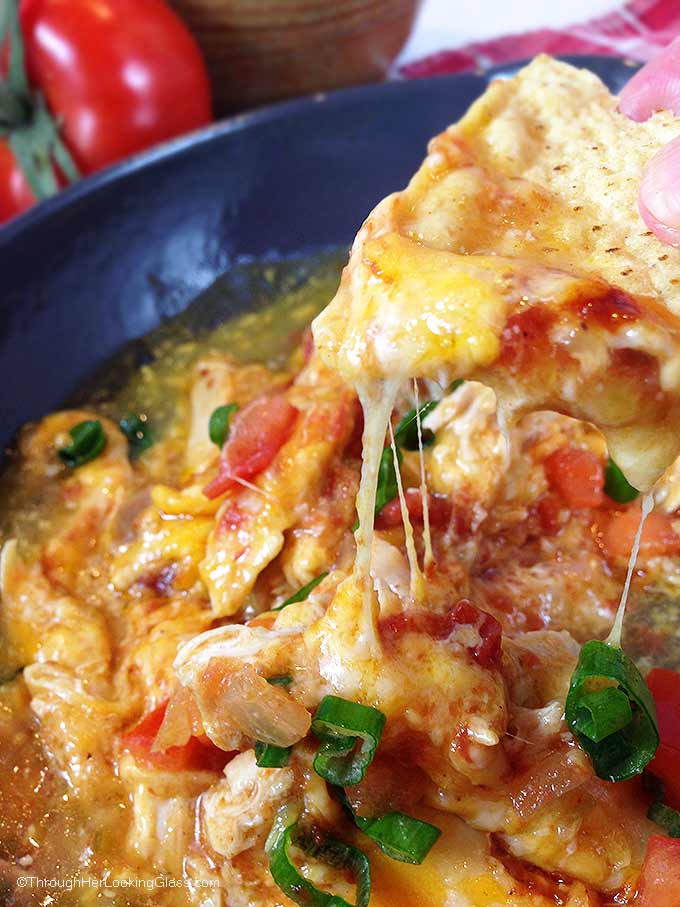 Chipotle Queso Fundido Skillet. Melty, stretchy, molten cheese. Shredded chicken and salsa, tomatillo & chipotle sauces. Smoky, spicy and sweet!