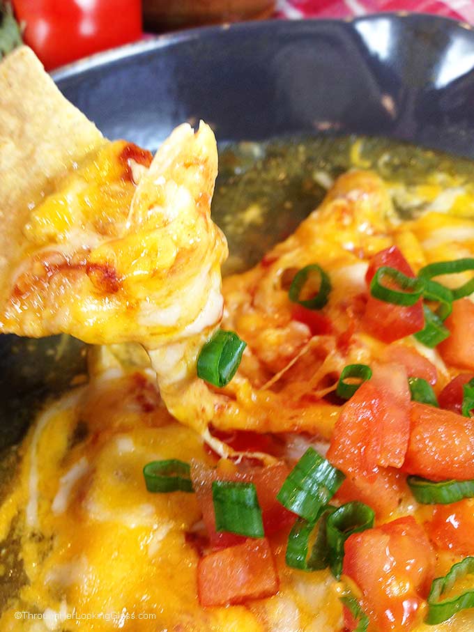 Chipotle Queso Fundido Skillet. Melty, stretchy, molten cheese. Shredded chicken and salsa, tomatillo & chipotle sauces. Smoky, spicy and sweet!