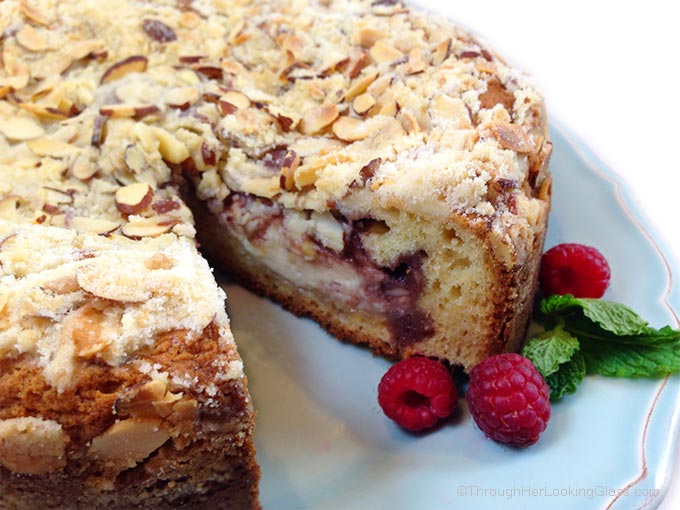 Raspberry Cream Cheese Coffee Cake: Almond cake, cream cheese filling, raspberry preserves and toasted almond crumb topping. Heaven!