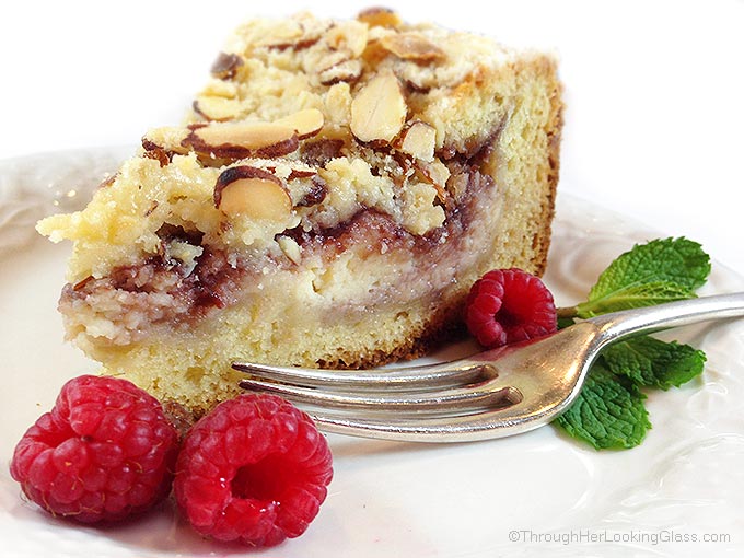 Raspberry Cream Cheese Coffee Cake: Almond cake, cream cheese filling, raspberry preserves and toasted almond crumb topping. Heaven!