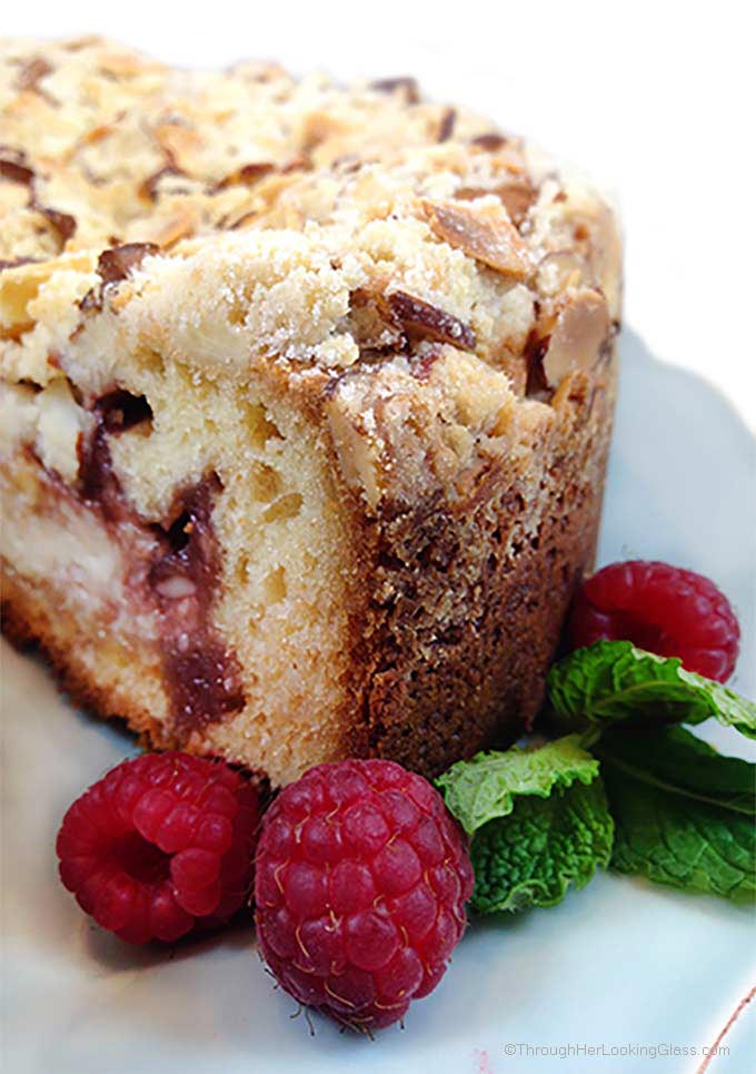 Raspberry Cream Cheese Coffee Cake: Almond cake, cream cheese filling, raspberry preserves and toasted almond crumb topping. Heaven!