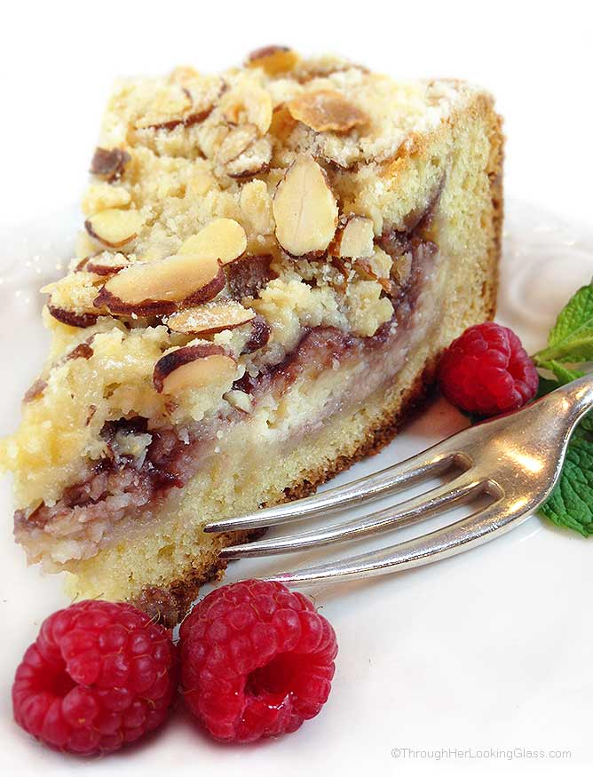 Raspberry Cream Cheese Coffee Cake: Almond cake, cream cheese filling, raspberry preserves and toasted almond crumb topping. Heaven!