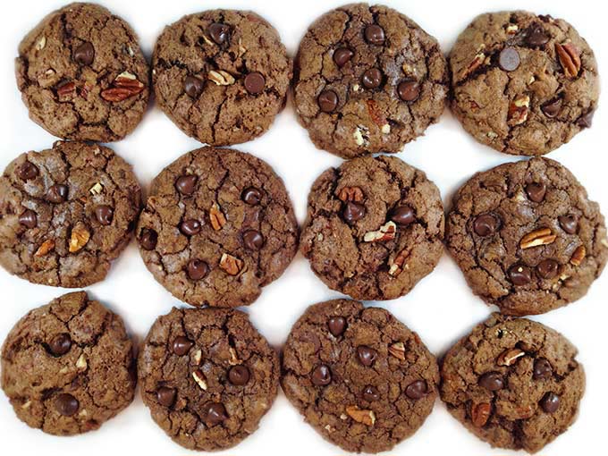 Bakery Style Chocolate Chocolate Chip Cookies are crunchy on the outside, chewy on the inside. Chock full of dark chocolate chips, pecans and cocoa. Yummers!