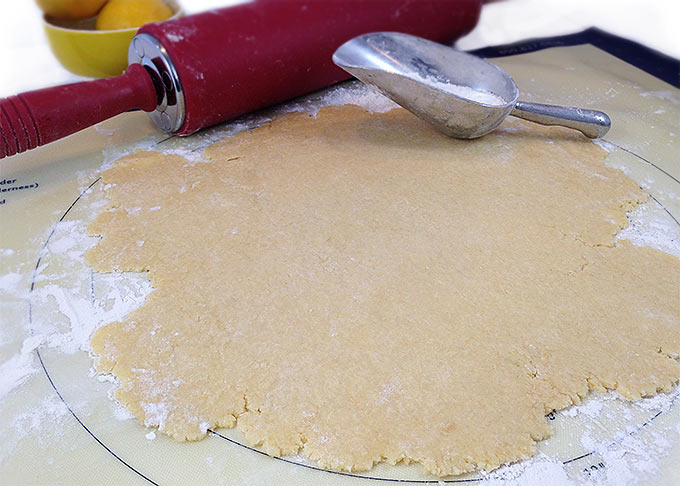 The homemade pie crust for this Italian ricotta pie rolled out on a floured surface