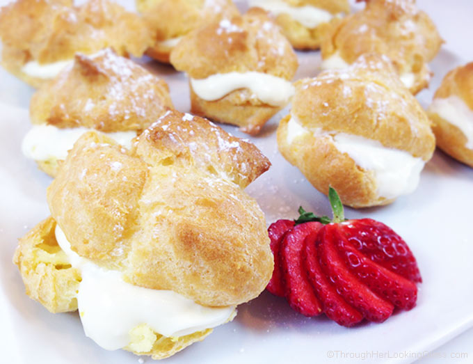 Easy Cream Puffs w/Lemon Filling are a light and puffy dessert, perfect for spring baby or wedding showers, even Easter. Beautiful presentation and so easy to make!