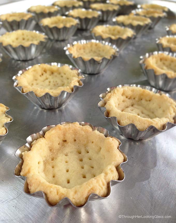 Irresistible Raspberry Lemon Tartlets. Crunchy, light tart shells layered with seedless raspberry jam, lemon curd and fresh raspberries. Need I say more?