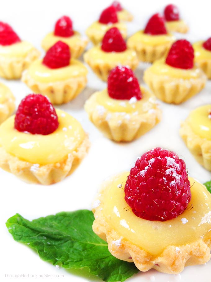 Irresistible Raspberry Lemon Tartlets. Crunchy, light tart shells layered with seedless raspberry jam, lemon curd and fresh raspberries. Need I say more?