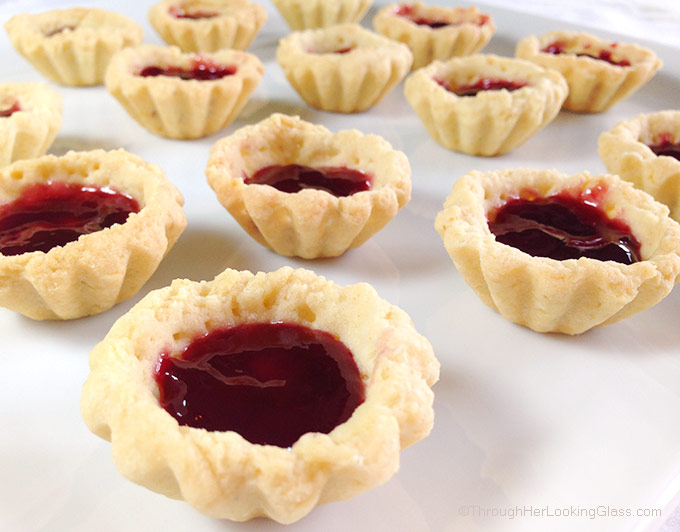 Irresistible Raspberry Lemon Tartlets. Crunchy, light tart shells layered with seedless raspberry jam, lemon curd and fresh raspberries. Need I say more?