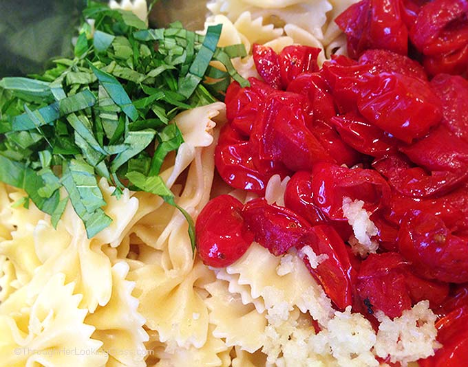 Blistered Tomato Basil Pasta Salad w/Truffle Oil. Ideal summer side dish. Garlic mingles w/basil, blistered tomatoes & farfalle pasta. Irresistible!