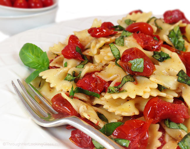 Blistered Tomato Basil Pasta Salad w/Truffle Oil. Ideal summer side dish. Garlic mingles w/basil, blistered tomatoes & farfalle pasta. Irresistible!