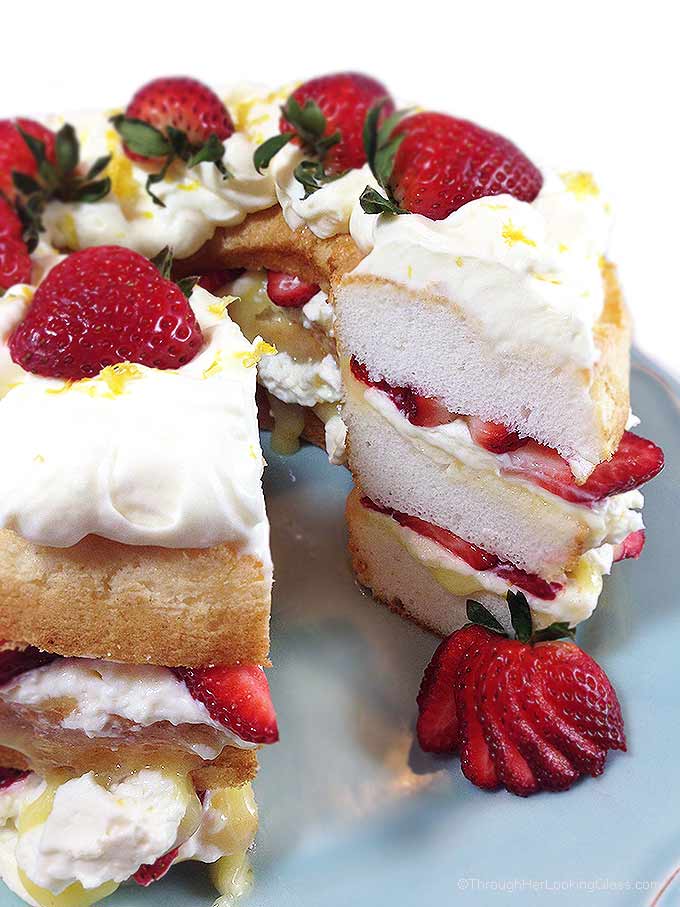 Fresh Strawberry and Lemon Angel Food Cake. Cake layers with fresh strawberries, lemon curd and homemade lemon whipping cream. Stunning and easy dessert!