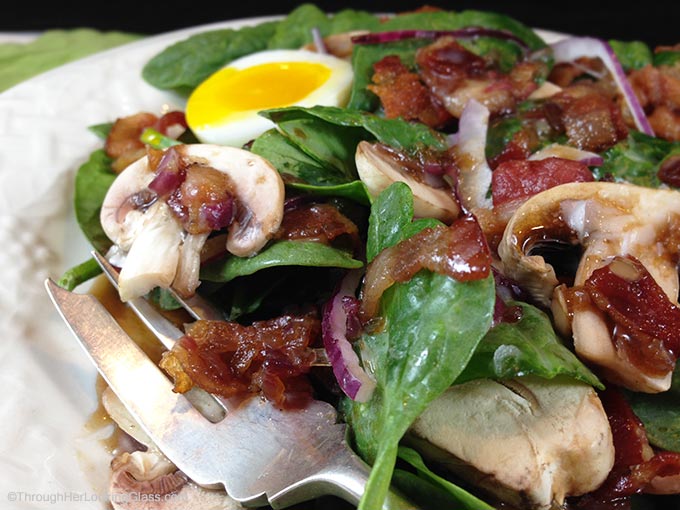 Maple Warm Bacon Dressing Spinach Salad: sweet maple syrup combines with warm bacon dressing atop spinach greens. Eating your greens never tasted so good!