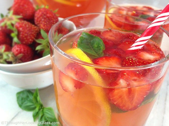 Refreshing Strawberry Basil Lemonade: perfect summer mocktail for everyone! Fresh basil steeps in strawberry simple syrup for an unusually delicious sipper!