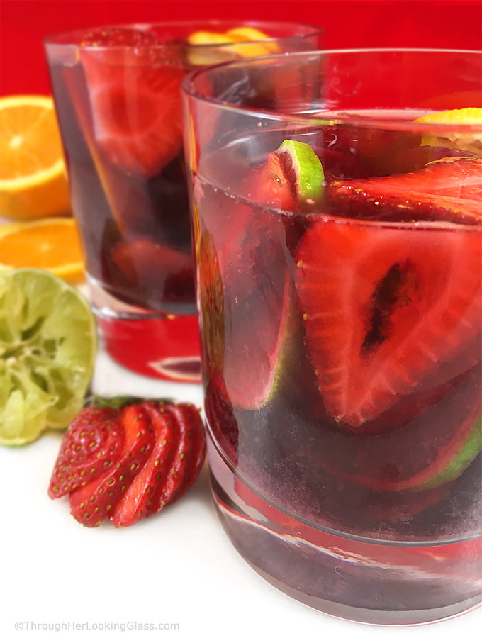 This lip-smacking Strawberry Sangria Recipe is a crowd-pleaser! Fresh fruit, merlot and a few other secret ingredients make the best sangria "brew" ever!