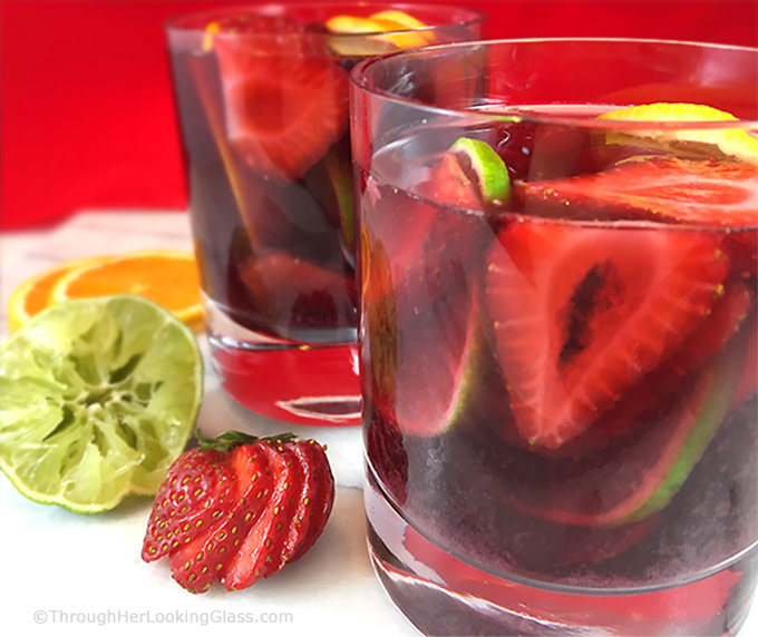 This lip-smacking Strawberry Sangria Recipe is a crowd-pleaser! Fresh fruit, merlot and a few other secret ingredients make the best sangria "brew" ever!