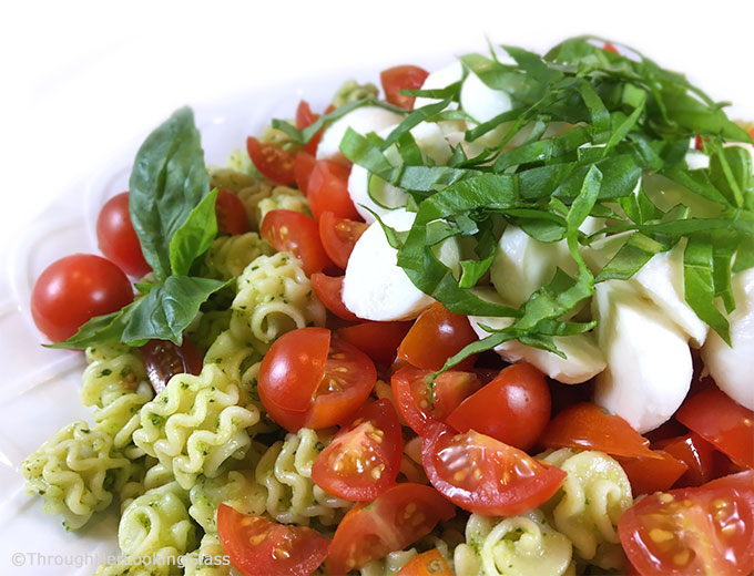 This Caprese Pasta Salad Recipe: perfect side incorporating your garden basil! Fresh basil pesto, pasta, sun-ripened tomatoes and fresh mozzarella. Delish!