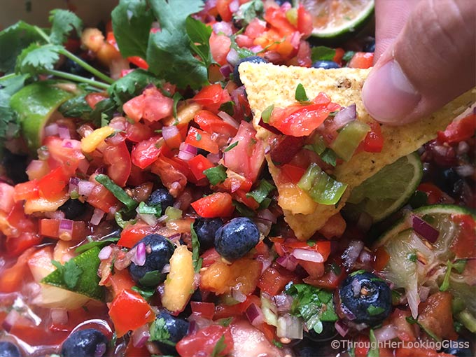 Fresh Peach Blueberry Salsa: fruity salsa with a delicious bite! This fresh salsa is so addictive. The peaches and blueberries are a sweet surprise!