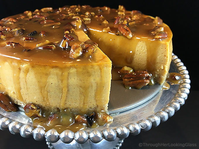 Maple Pumpkin Cheesecake w/Maple Praline Pecan Sauce. Creamy pumpkin cheesecake with a hint of maple smothered in buttery maple praline pecan sauce!