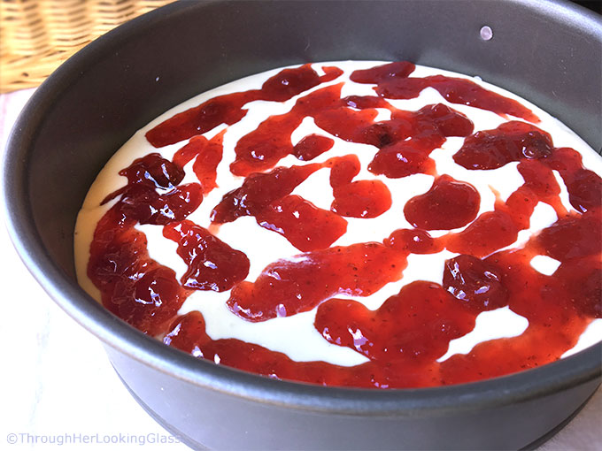 This rich & creamy Strawberry Cheesecake Recipe is the perfect make ahead dessert. Bake the cheesecake, ladle on fresh strawberry sauce before serving.