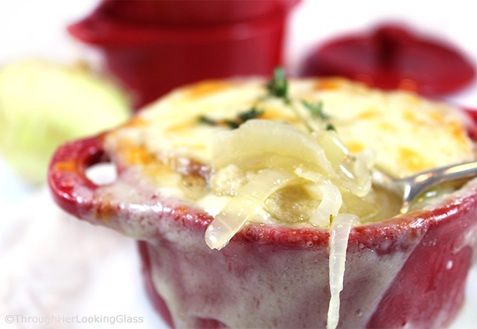 Apple Cider Caramelized Onion Soup is a sweet and flavorful version of your favorite French onion soup. Apple cider, chicken and beef broth simmer with sweet onions and thyme. Topped with a slice of French bread and bubbly sharp cheddar cheese, this is a delicious main dish or appetizer soup.