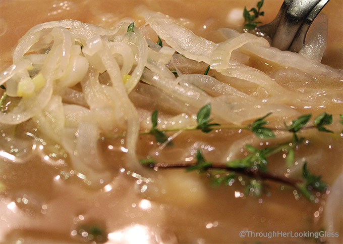 Apple Cider Caramelized Onion Soup is a sweet and flavorful version of your favorite French onion soup. Apple cider, chicken and beef broth simmer with sweet onions and thyme. Topped with a slice of French bread and bubbly sharp cheddar cheese, this is a delicious main dish or appetizer soup.