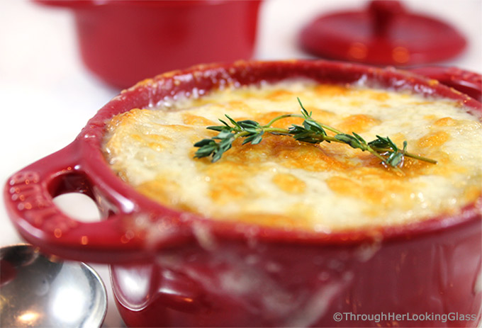 Apple Cider Caramelized Onion Soup is a sweet and flavorful version of your favorite French onion soup. Apple cider, chicken and beef broth simmer with sweet onions and thyme. Topped with a slice of French bread and bubbly sharp cheddar cheese, this is a delicious main dish or appetizer soup.