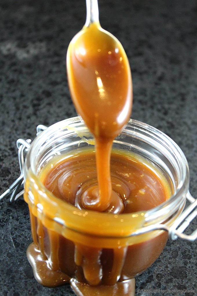 Homemade Salted Caramel Sauce: easy to make & just four ingredients. A drizzle of this velvety smooth salted caramel sauce elevates any dessert to stardom.