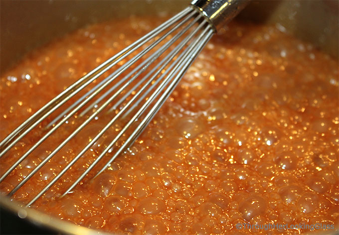 Homemade Salted Caramel Sauce: easy to make & just four ingredients. A drizzle of this velvety smooth salted caramel sauce elevates any dessert to stardom.