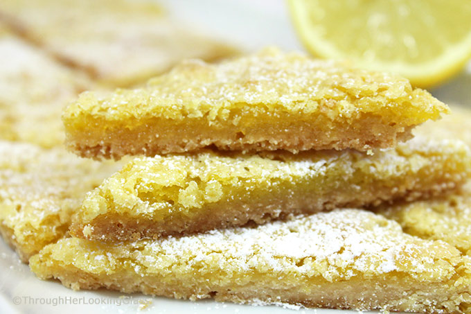 Lemon Slice Recipe: rich and lemony, these buttery Lemon Slices will take you back to the glass case at the old-fashioned bakery. Fresh lemon juice & zest!