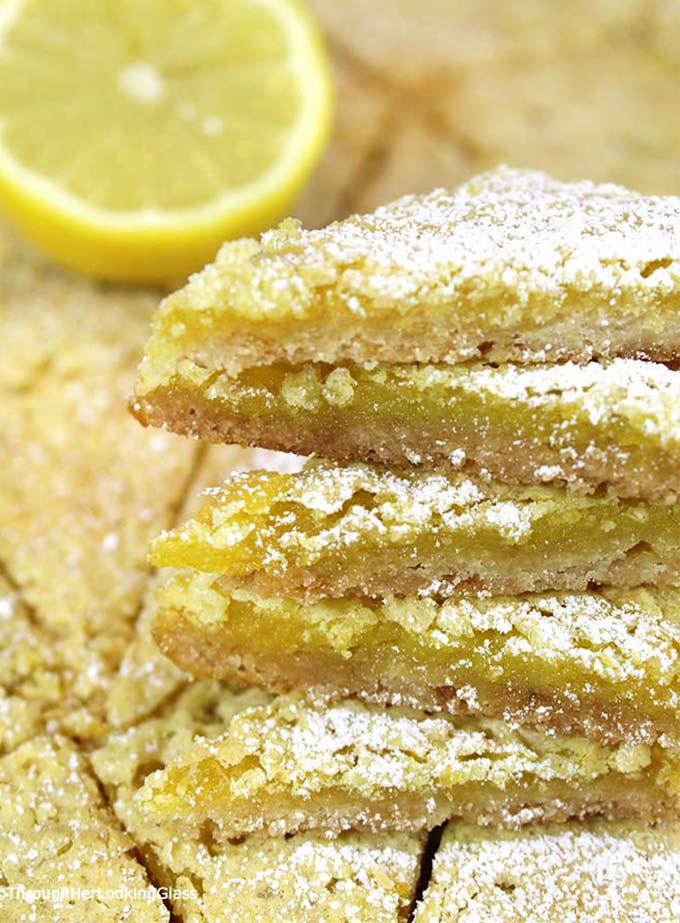 Lemon Slice Recipe: rich and lemony, these buttery Lemon Slices will take you back to the glass case at the old-fashioned bakery. Fresh lemon juice & zest!